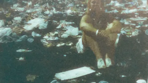 Sue Goddard A picture of Sue Goddard in the mess at Wembley after the Live Aid concert in July 1985. 