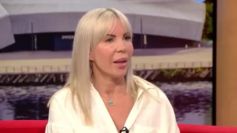 BBC Julie Dale sitting on the BBC Breakfast red couch