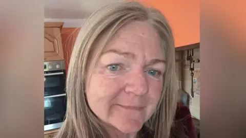 Contributed Nicola Smart smiles at the camera in a selfie-style image. She has straight blonde hair. A kitchen can be seen behind her.