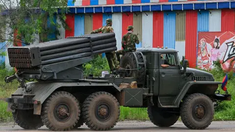 Getty Images Cambodian soldiers tride a truck equipped with a Russian-made BM-21 rocket launcher in Cambodia's northern Oddar Meanchey province